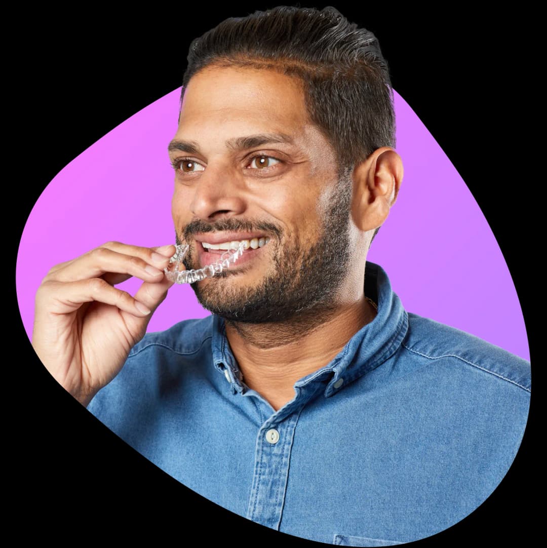 Man holding aligner