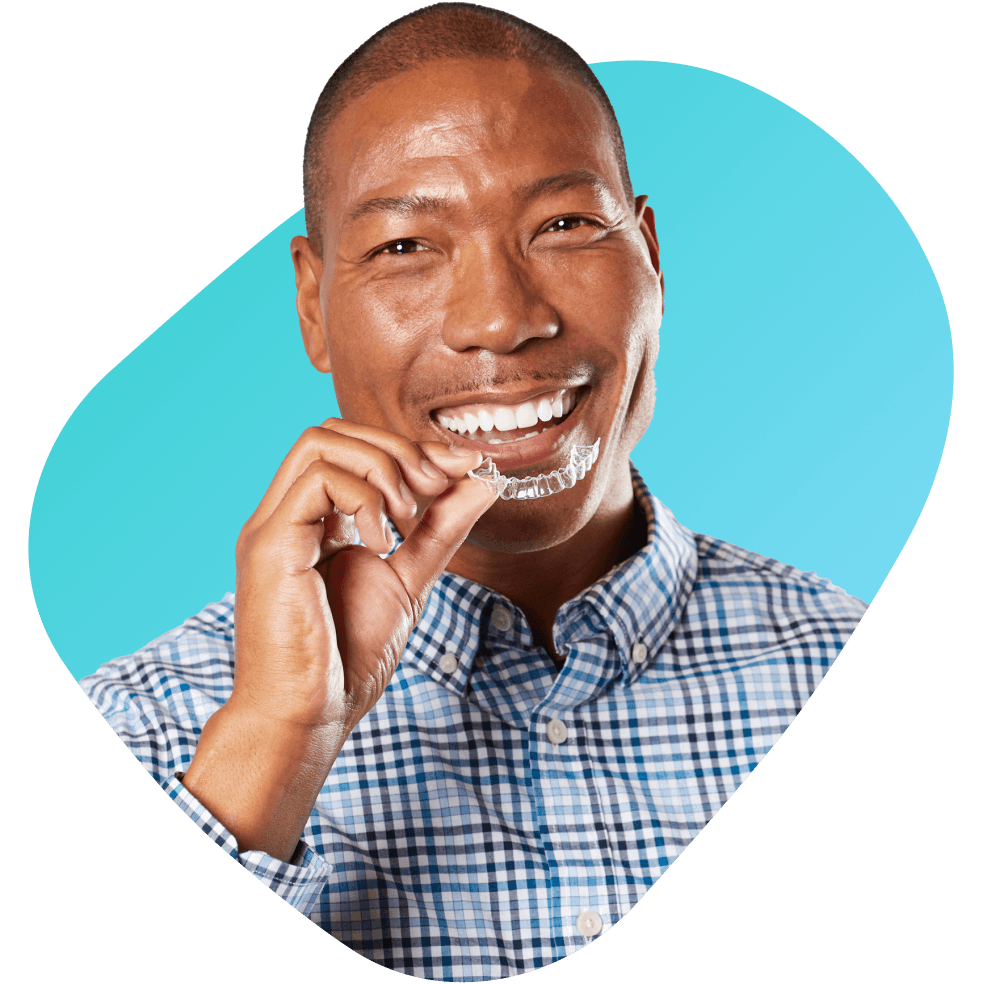 Person smiling with aligners