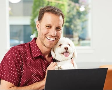 Man with dog and computer